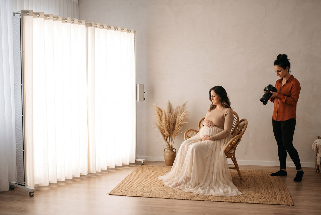 Pregnant client in a wicker chair with pampas grass, lit by a LEDWindow PRO panel in a maternity studio