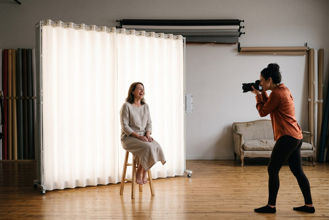 Client laughing on a stool while the photographer shoots handheld under continuous light from a LEDWindow PRO panel